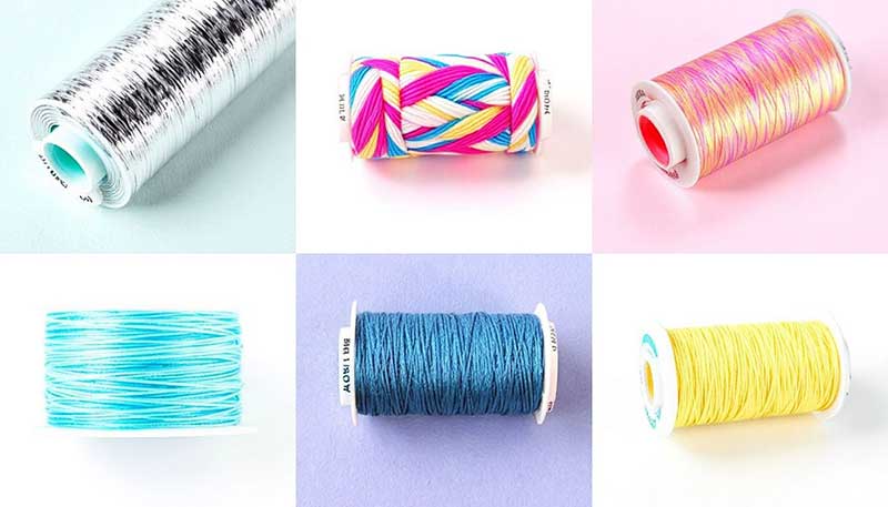 Different types of machine embroidery threads in spools.